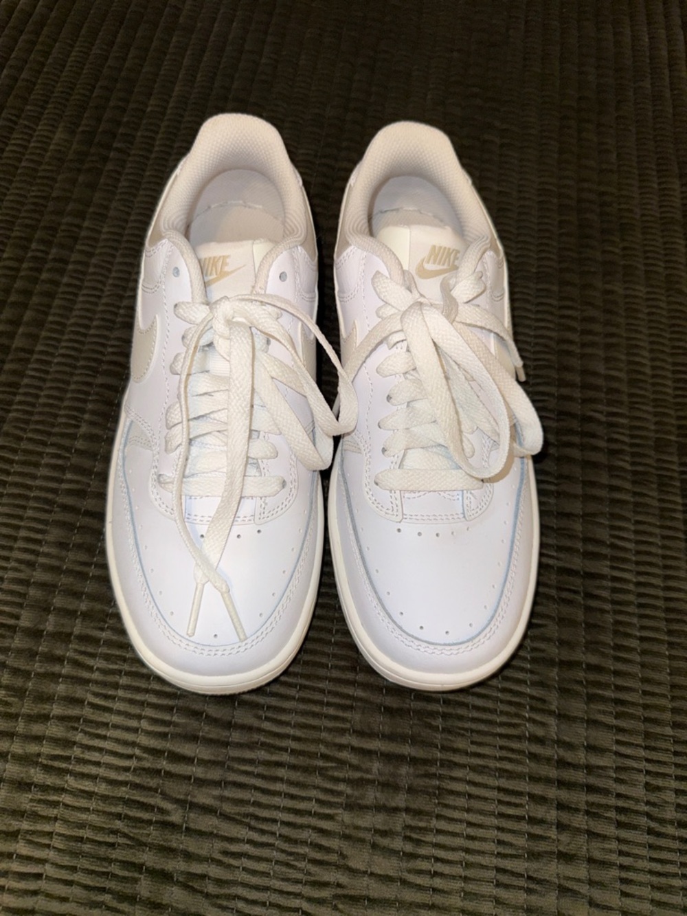 Nike White Low-Top Leather Sneakers with Gold Logo